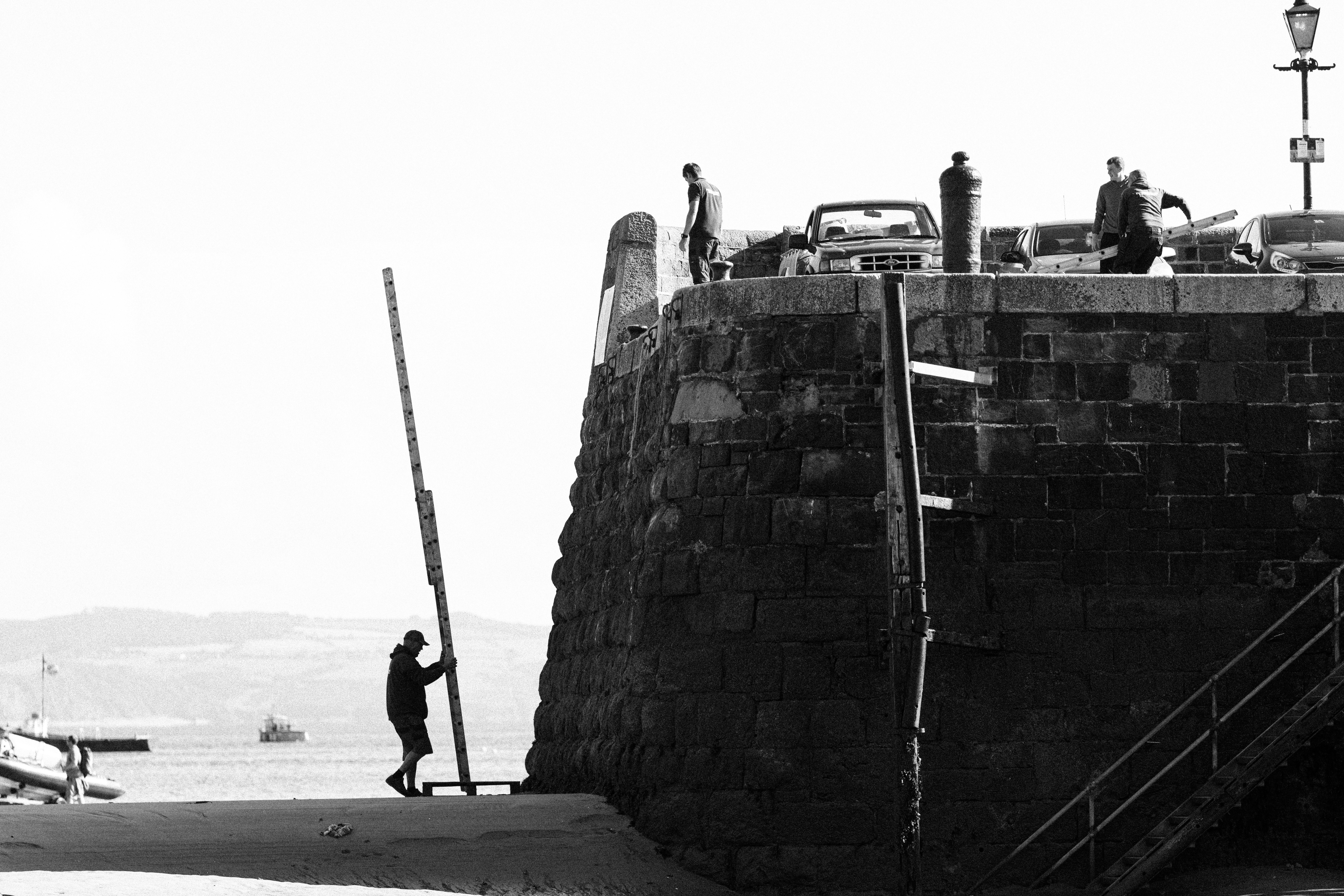 a person standing on a stone wall