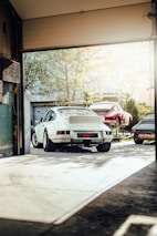 a group of cars parked in a garage