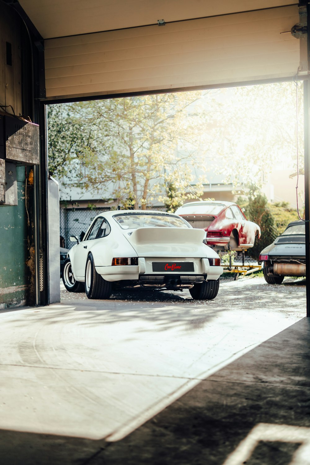 a group of cars parked in a garage