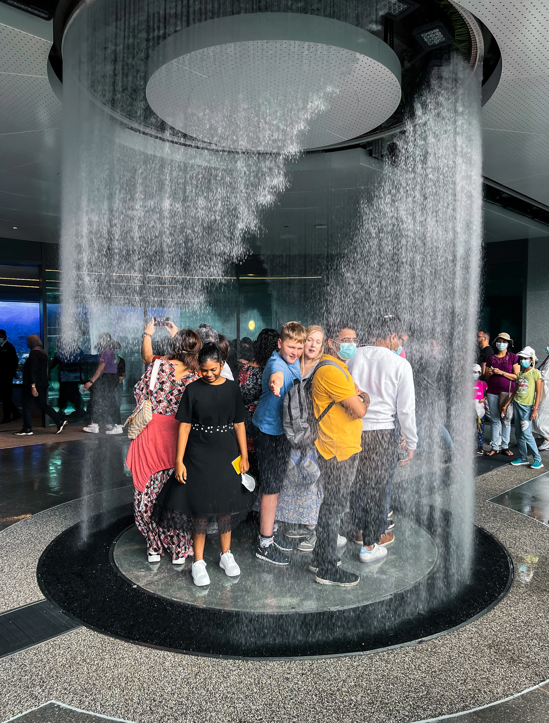 woman wearing yellow long-sleeved dress under white clouds and blue sky during daytime
