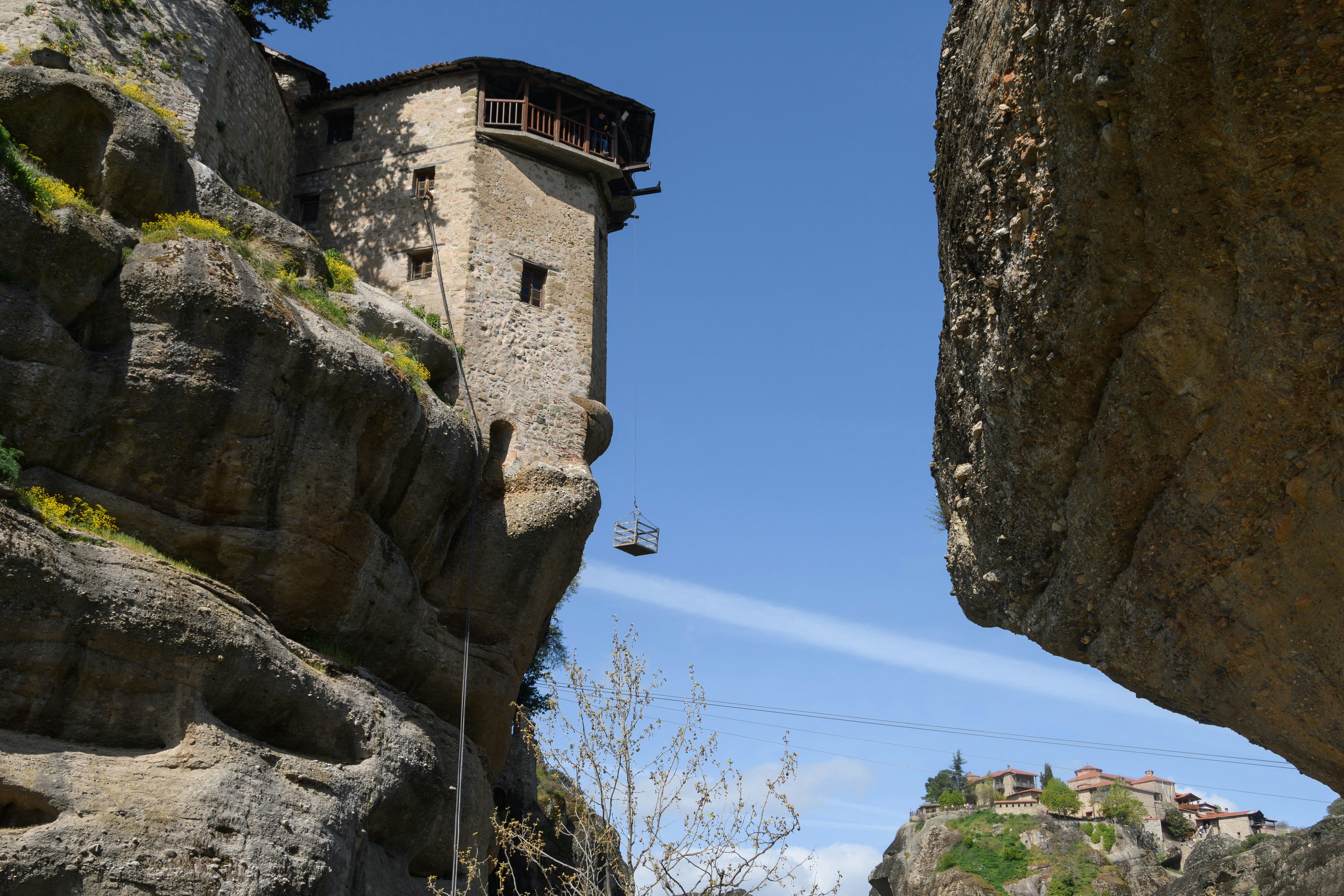 a stone building on a cliff