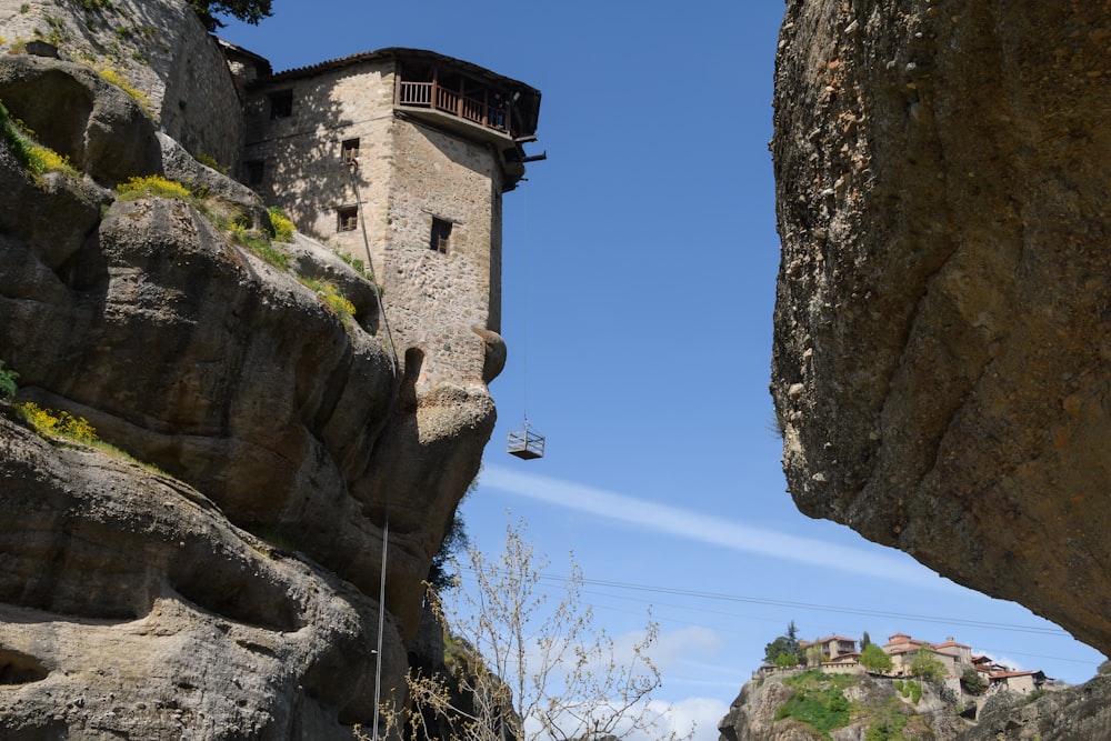 a stone building on a cliff