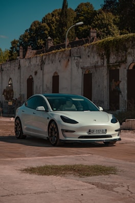 A shiny white sedan parked near Old Power House, Bilaspur.