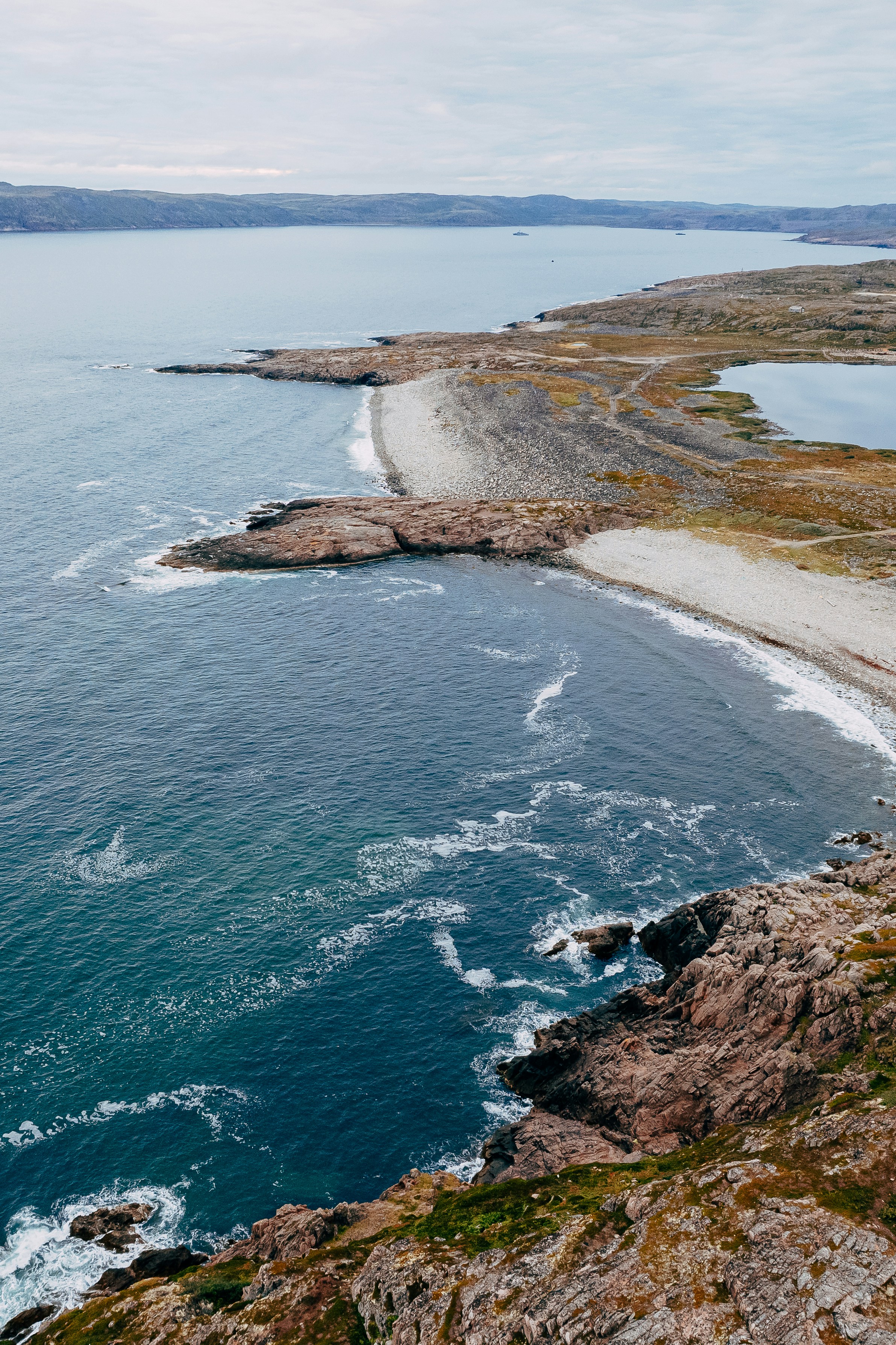 a beach with rocks and water