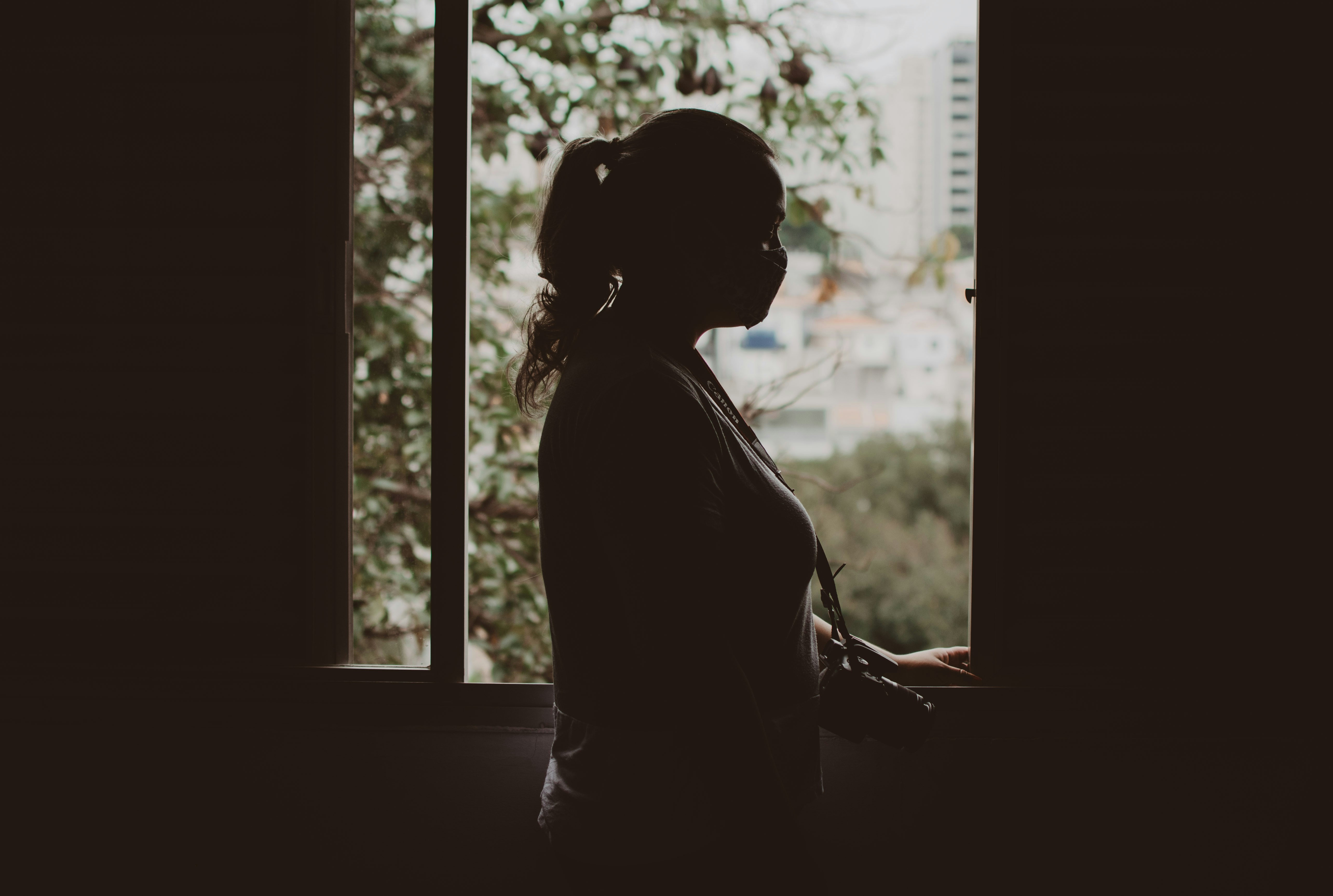 a person sitting in a window