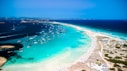 a beach with boats and water