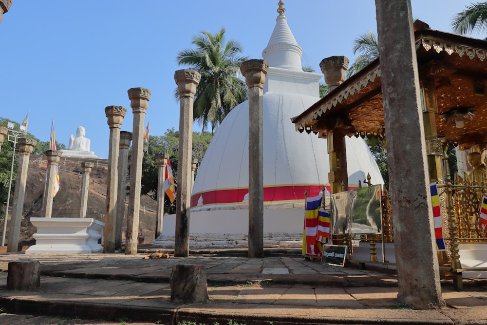 a building with pillars and a flag