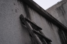 a stone wall with a statue on it