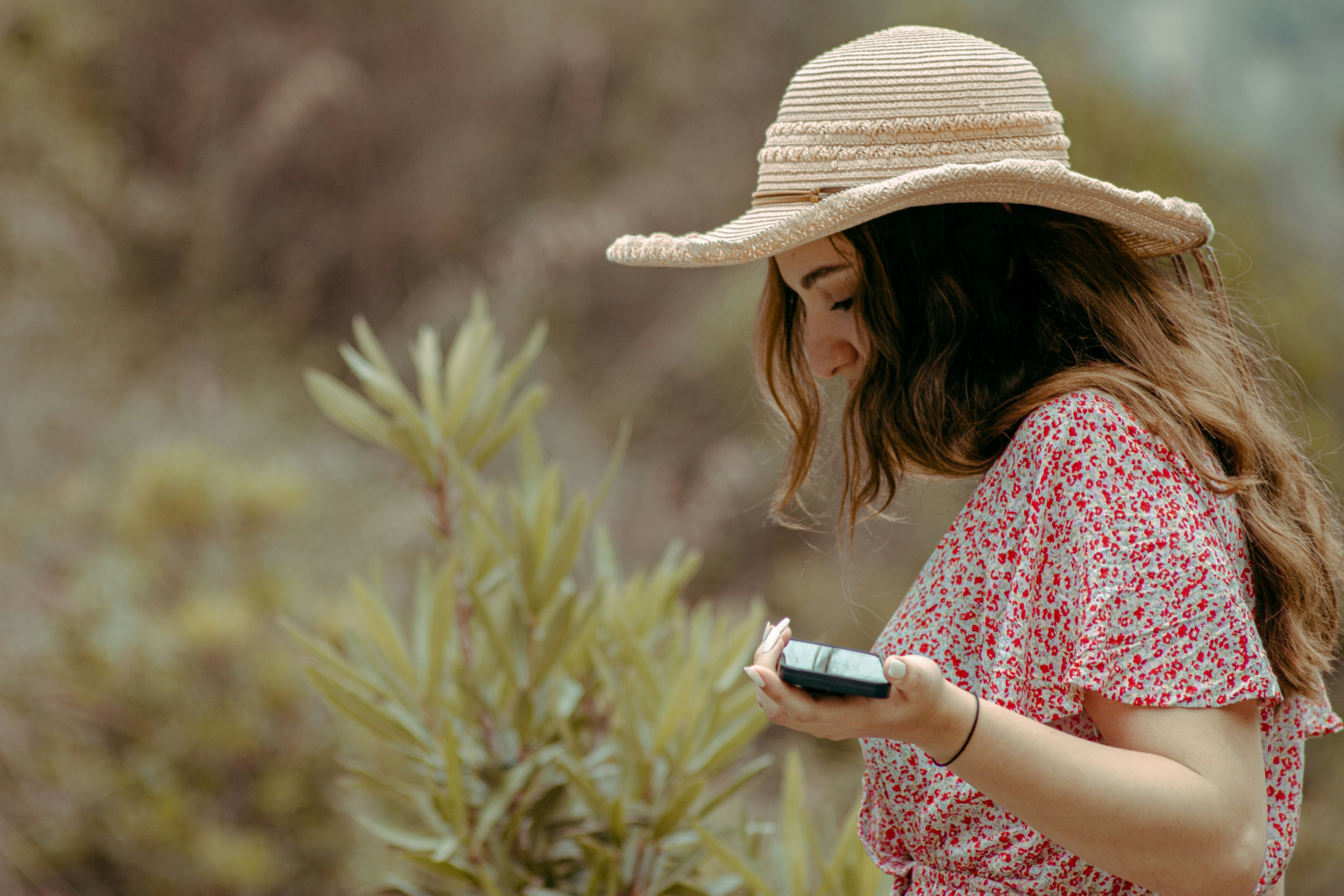 a woman holding a cell phone