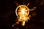 a light bulb with a flame