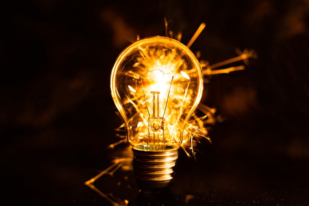 a light bulb with a flame, theocrazzolara.weebly.com