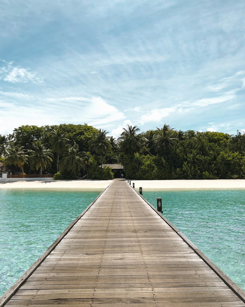 a dock leading to a beach