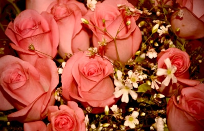 Elegant white and pink floral arrangement perfect for weddings or anniversaries.