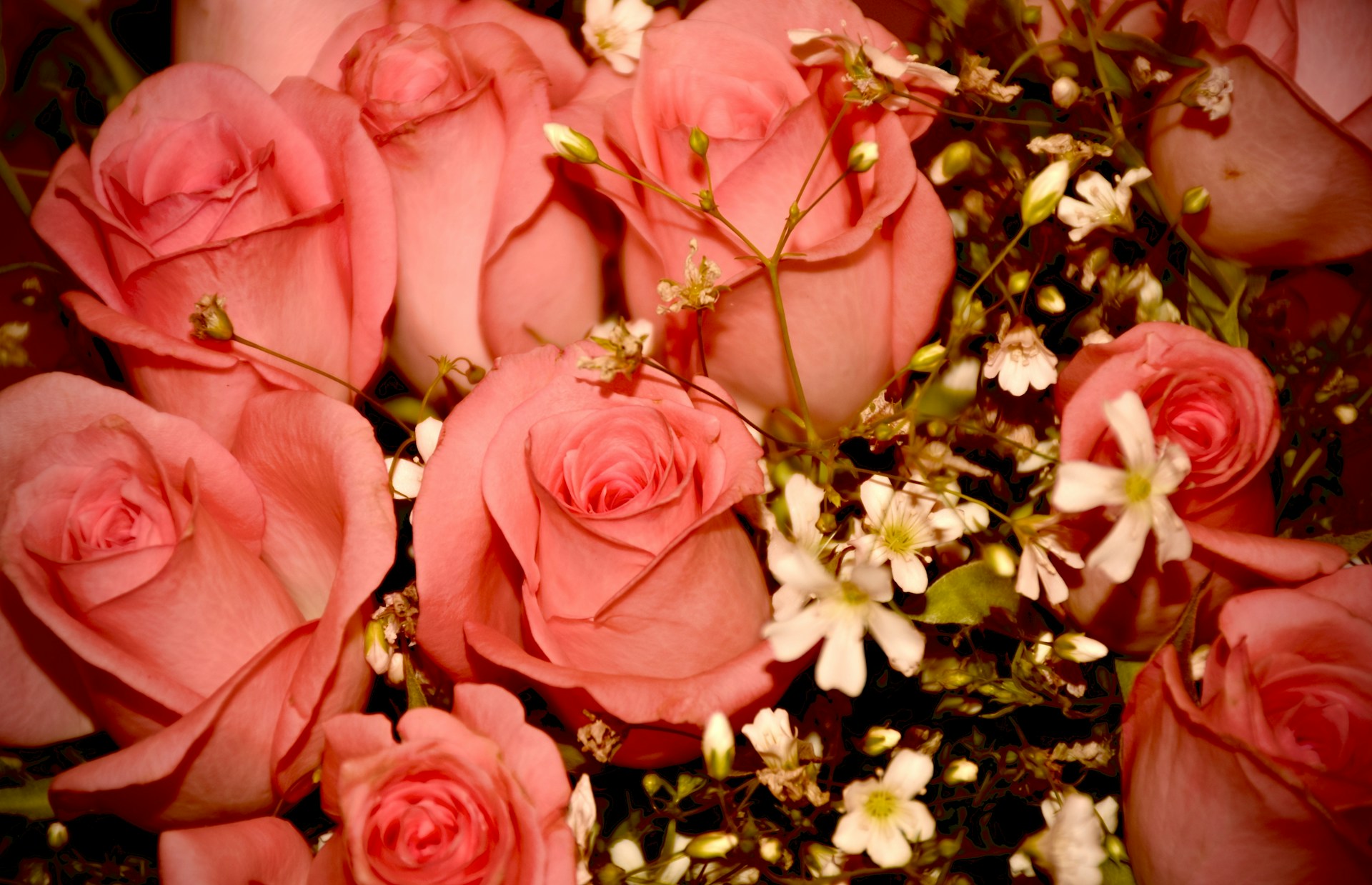 A vibrant bouquet of red, pink, and white roses elegantly arranged in a rustic vase, perfect for a romantic gift.