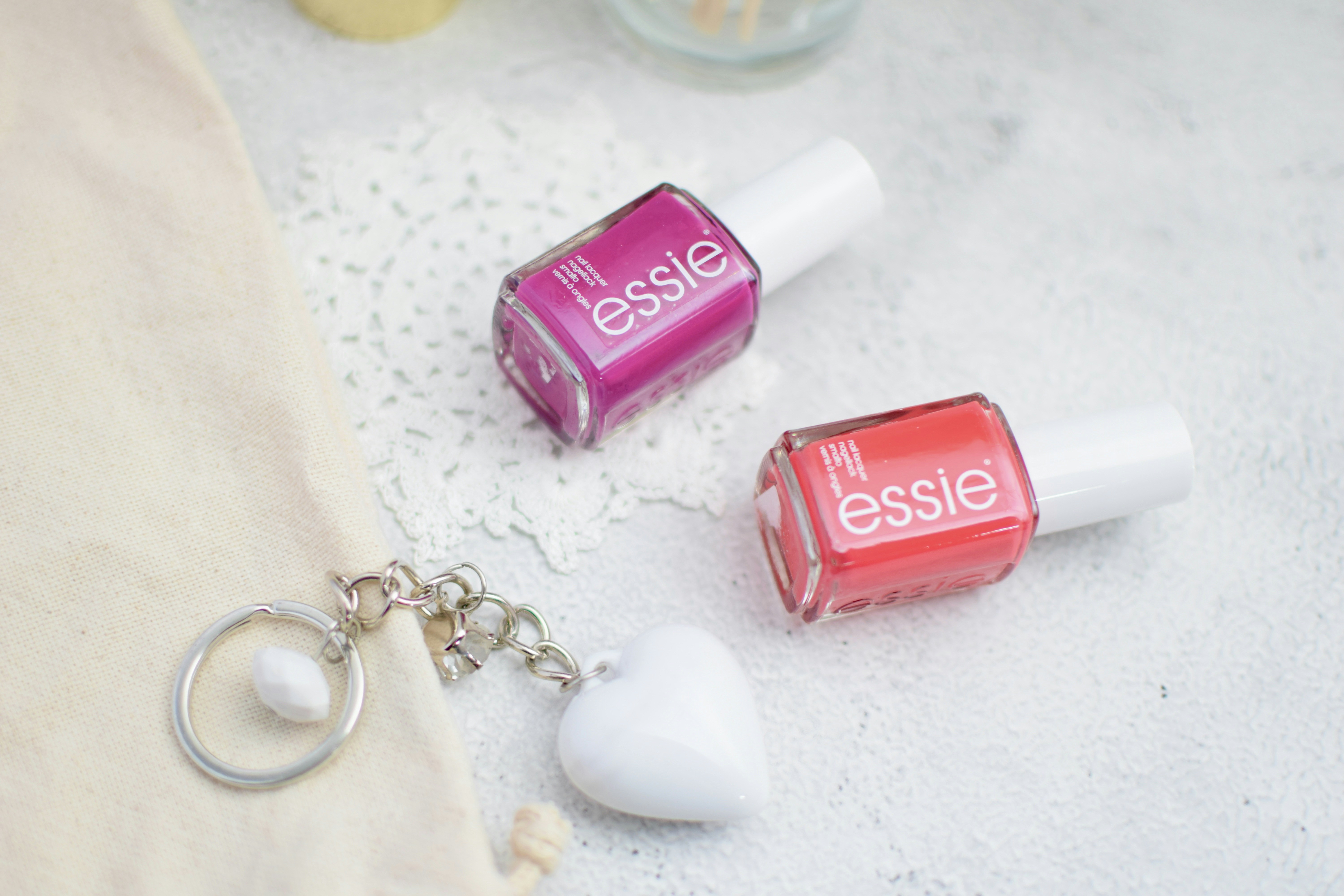 a set of small pink and white earrings