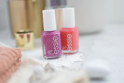 A cozy spa room set up for a nail art workshop with colorful polish bottles and brushes neatly arranged.
