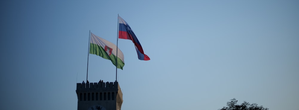 a few flags flying in the air