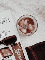 Flat lay of Lumina’s latest collection pieces arranged with city maps and coffee cups.