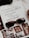 An open magazine displays a page with stylish typography in Portuguese and has a focus on fashion accessories such as sunglasses and jewelry. The sunglasses rest on top of the open page, with additional images showcasing intricate jewelry pieces.