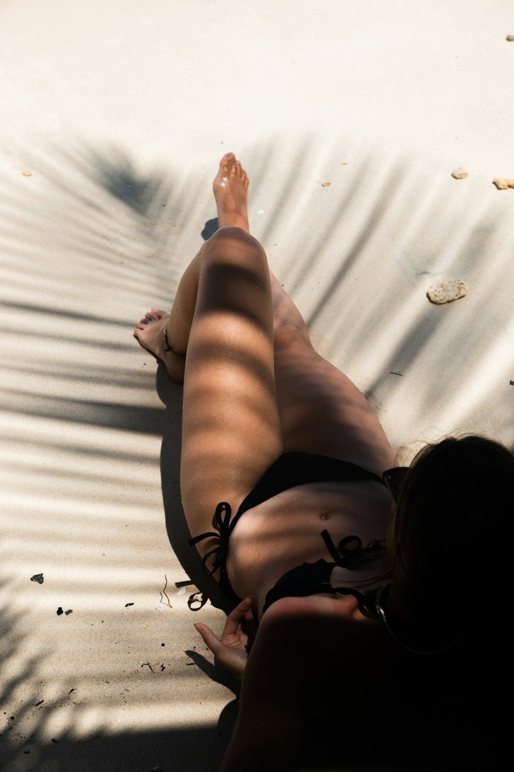 a person lying on the beach