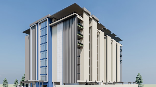 A modern multi-story building featuring large glass windows and architectural panels, set against a clear blue sky. The structure has a sleek design with vertical and horizontal elements, complemented by shadow effects from overhanging components.