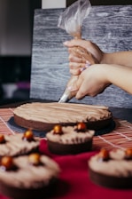a person cutting a cake