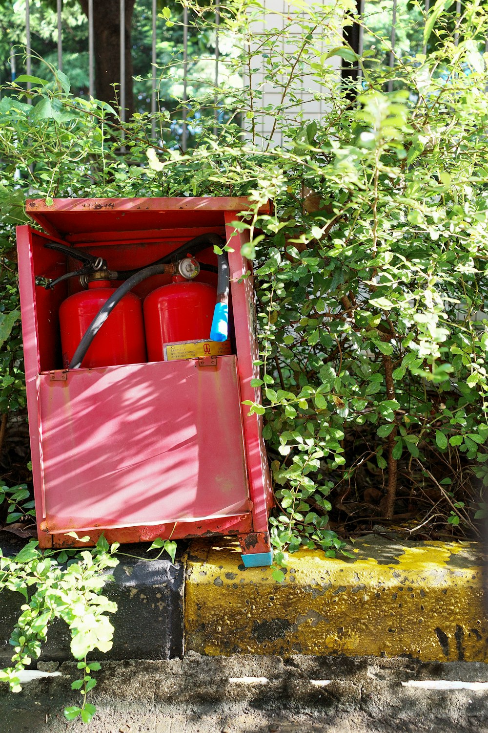 a red garbage can