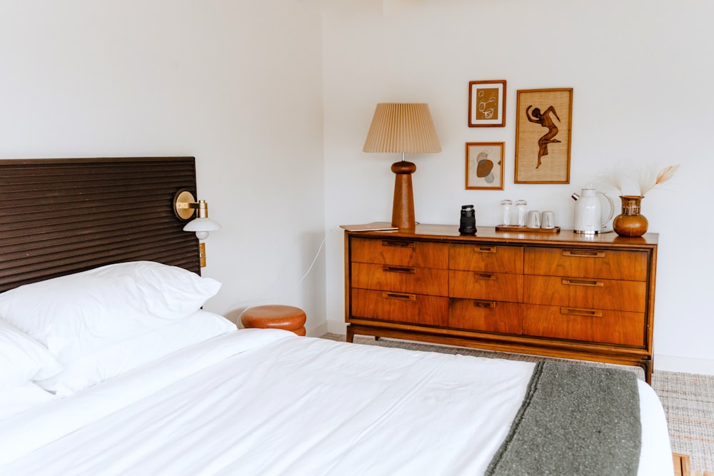 a bed with a white bed spread