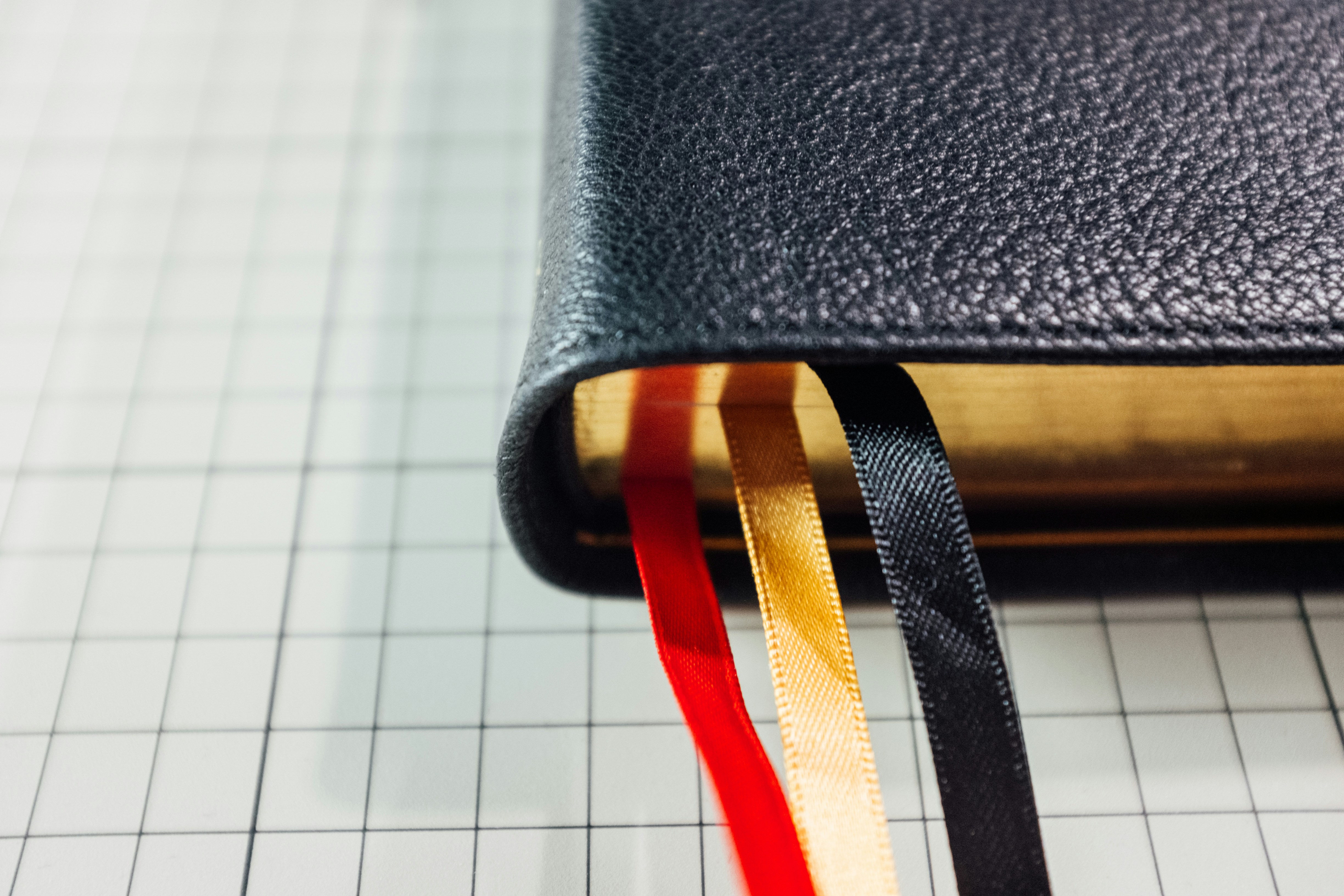 a pair of black and orange sunglasses