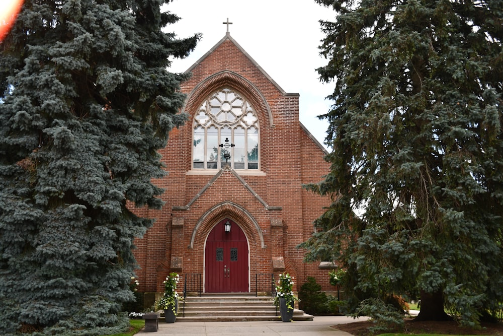 a brick church with a cross on top