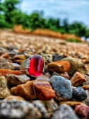 Ruby bracelet displayed with shallow depth of field, capturing its rich red hues against a dark backdrop.