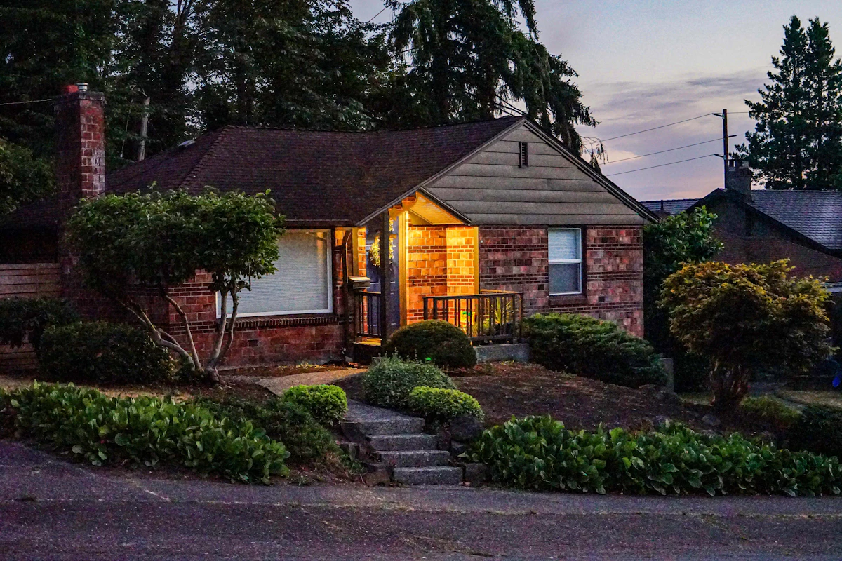 Today: Seattle brick home on a large lot at dusk