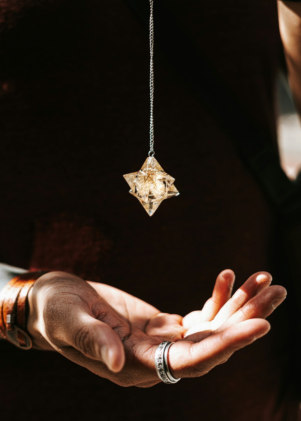 a person holding a key chain