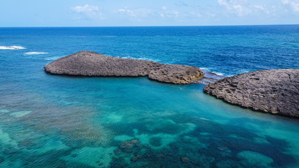 a group of rocks in the water