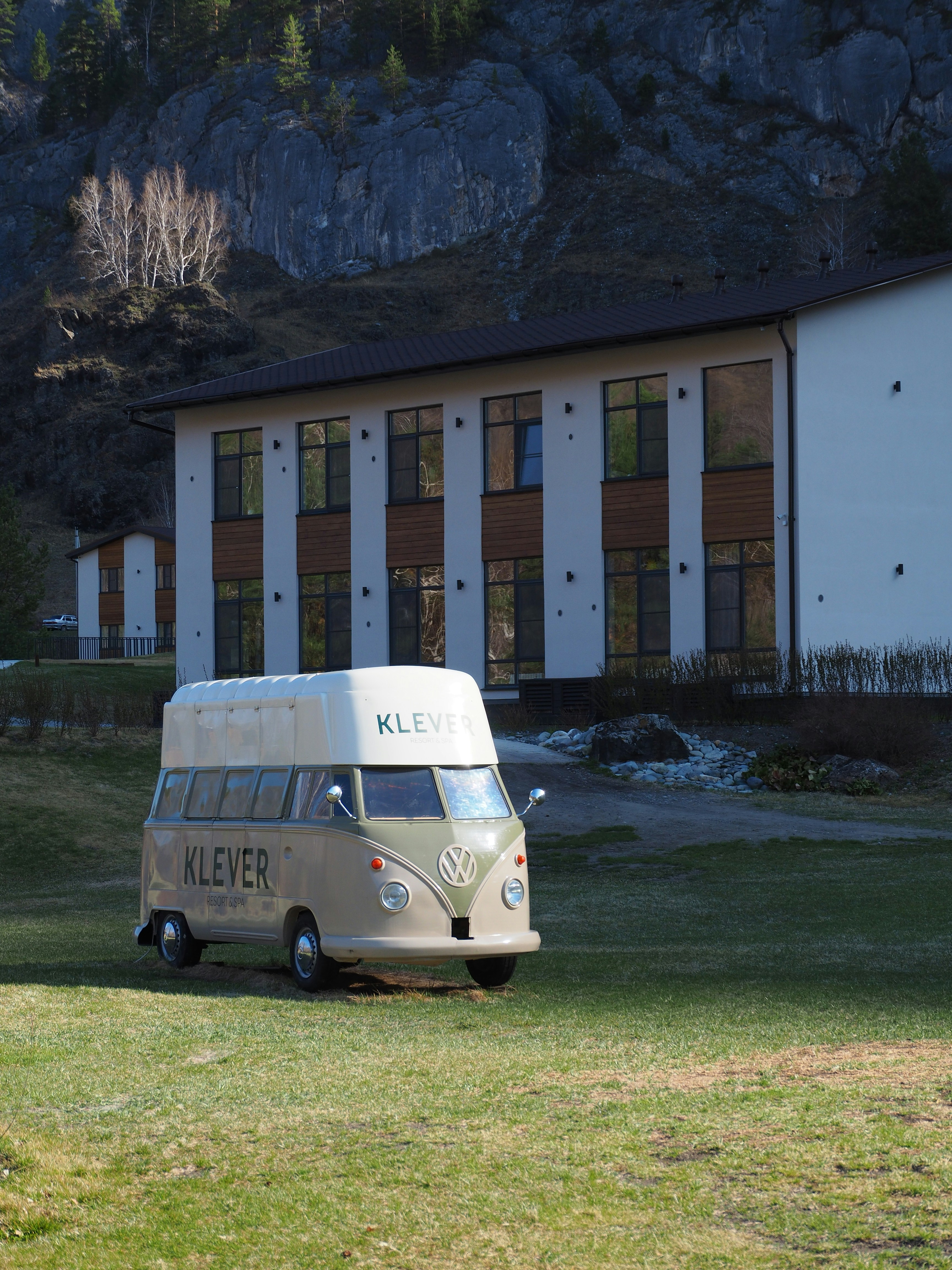 a van parked in front of a building with columns