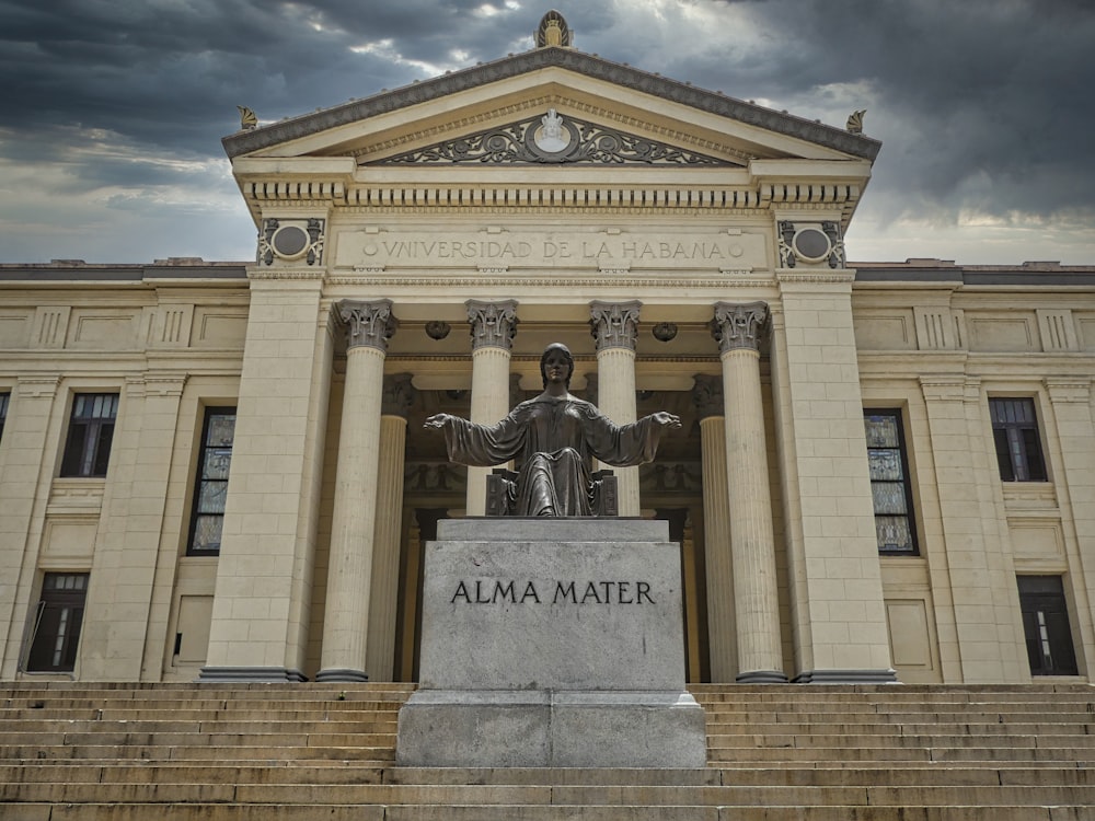 a statue in front of a building