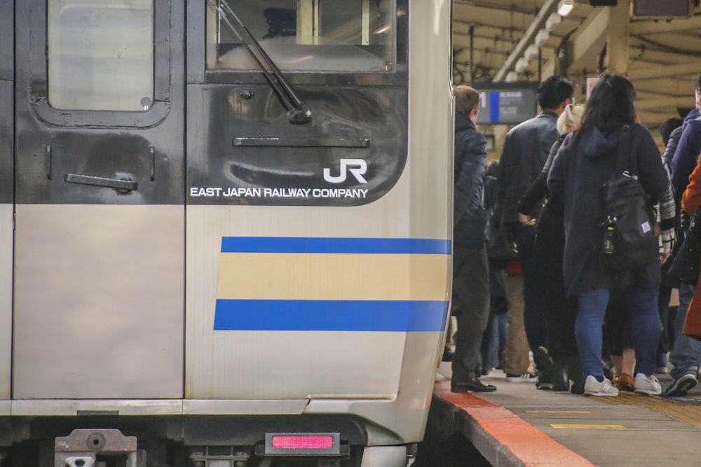 people boarding a train