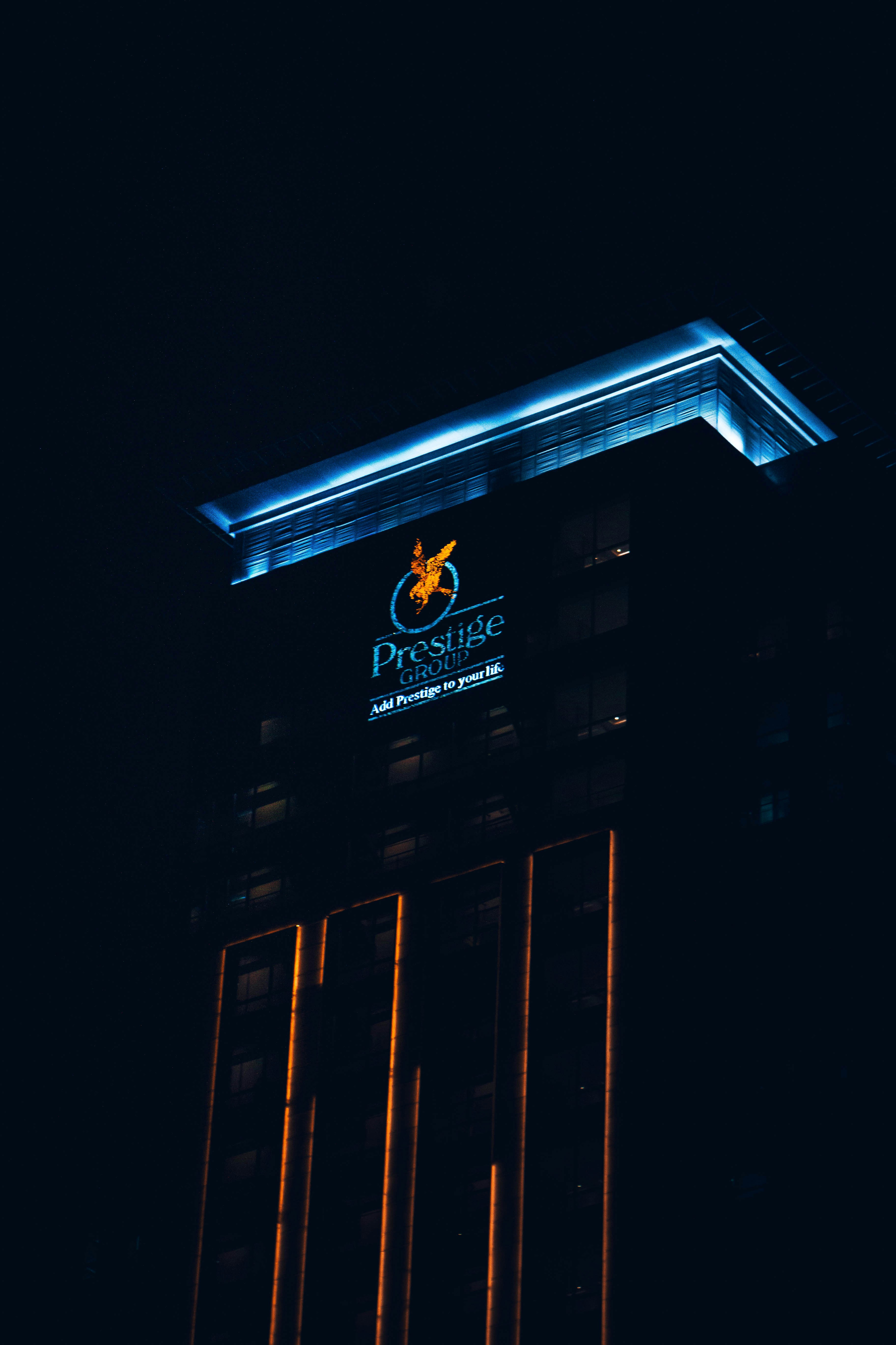 Prestige Group real estate logo on residential building