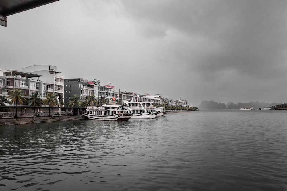 a body of water with boats in it and buildings around it