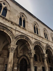 Historic colonial building facade in Puebla with intricate stonework.