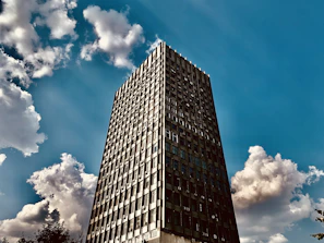 Wide shot of the office exterior showcasing the Midwest Intercontinental sign against a clear sky