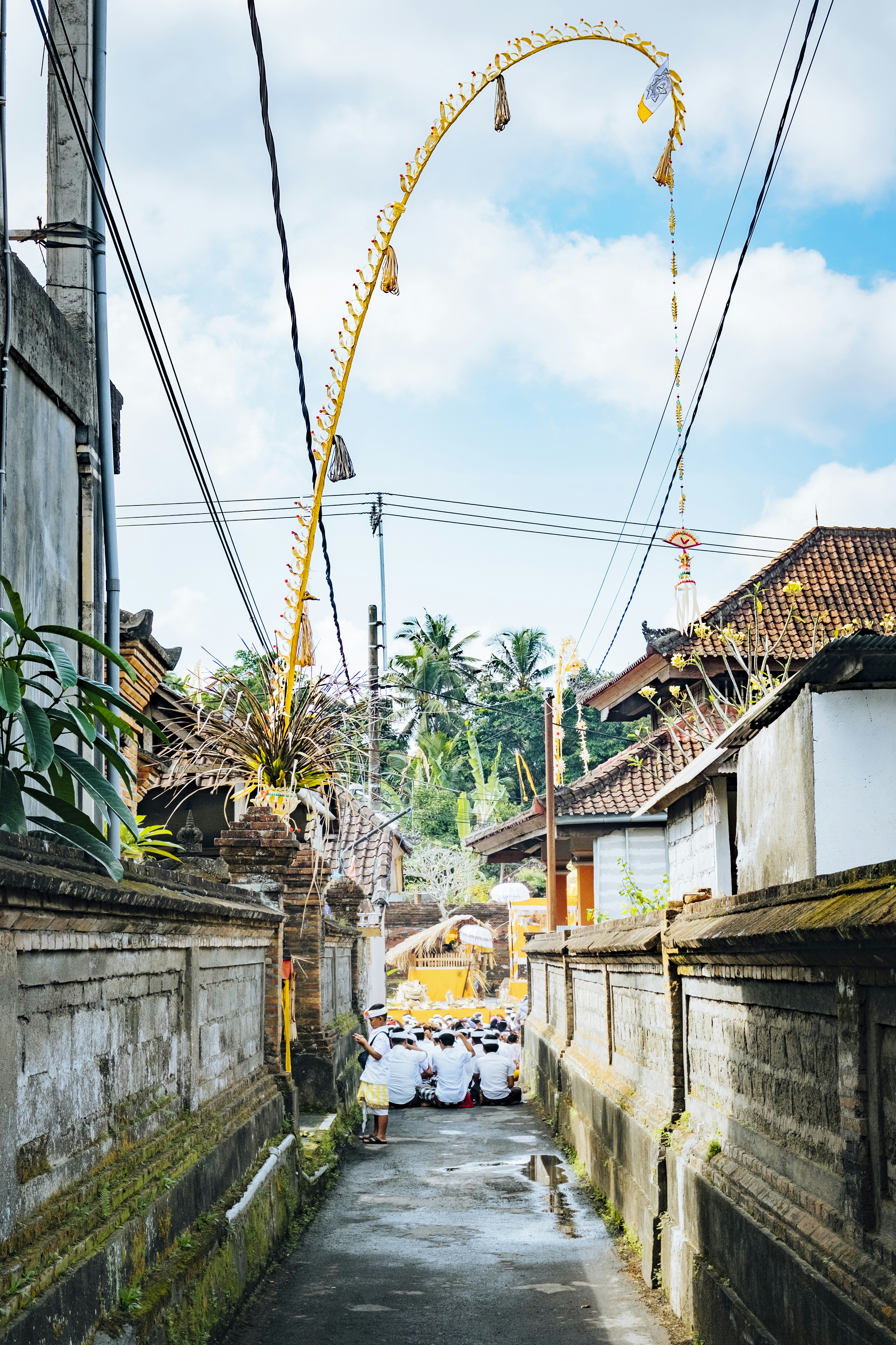 a street with buildings and a ferris wheel