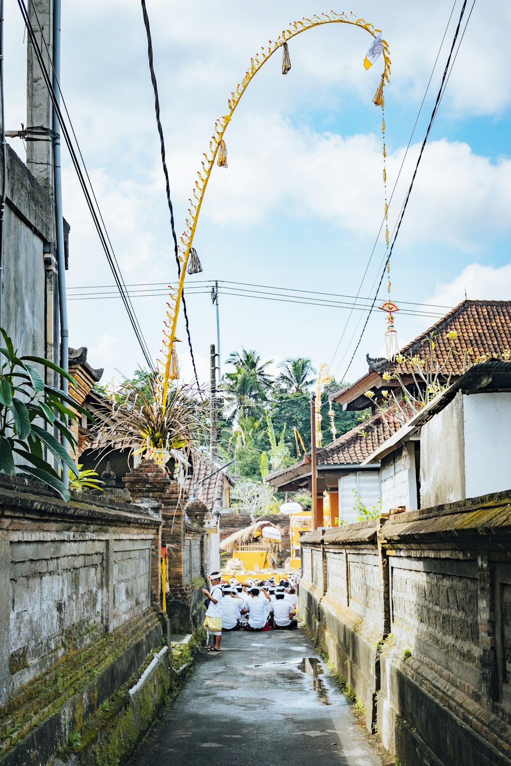 a street with buildings and a ferris wheel