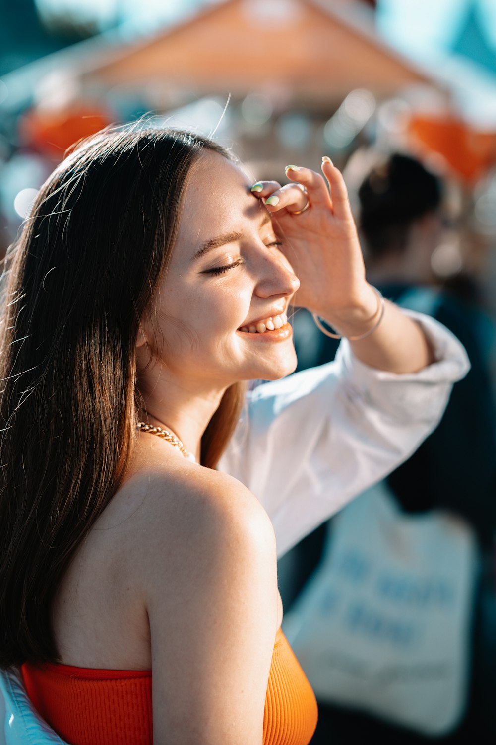 a woman with her hand on her face