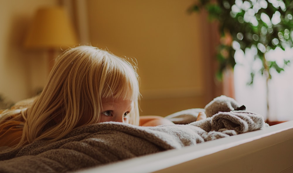 a girl lying on a bed