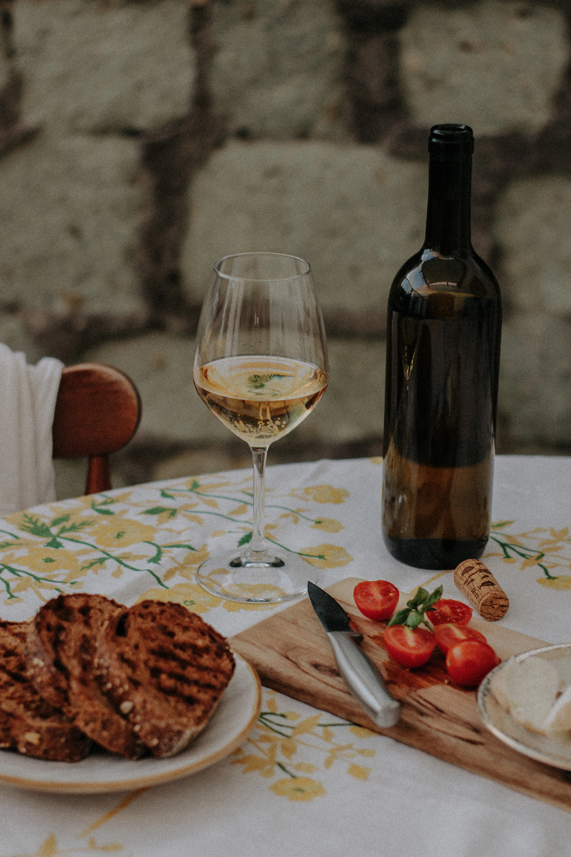woman wearing yellow long-sleeved dress under white clouds and blue sky during daytime