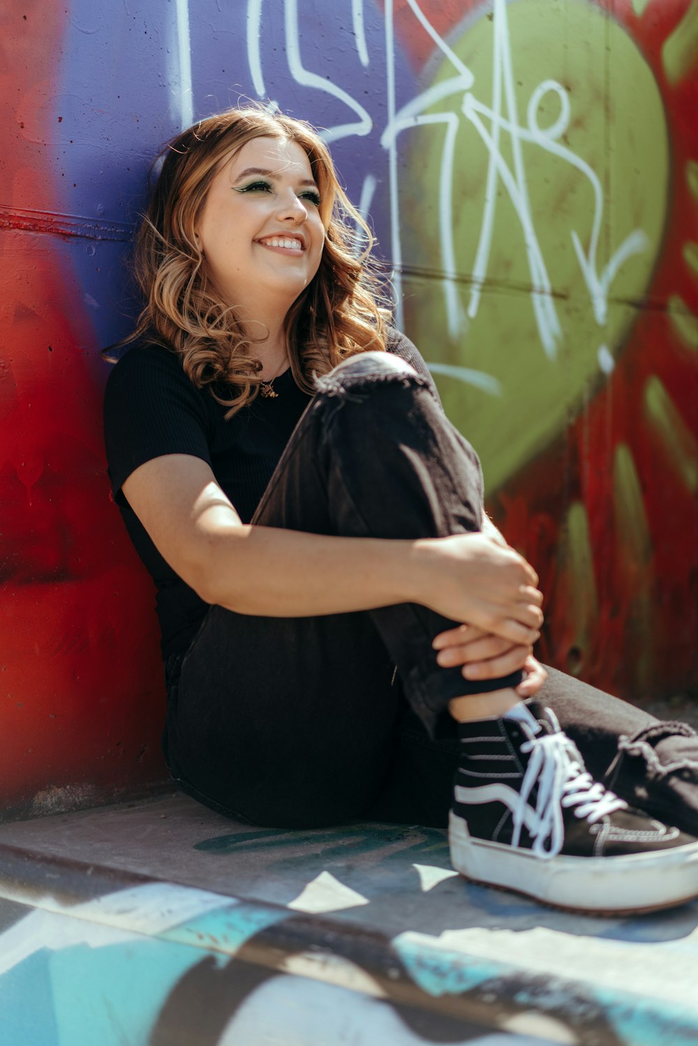 a woman sitting on the ground