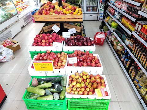 Close-up of fresh groceries with price tags highlighting discounts.