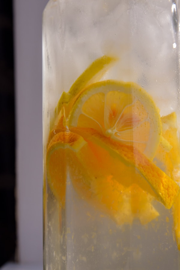 A yellow and white fish in a glass