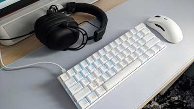 a keyboard and mouse on a desk